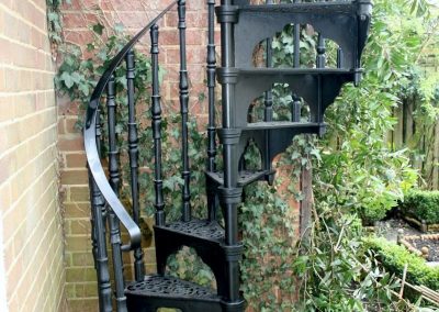 Entry onto garden using a cast spiral staircase